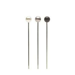 Three metallic decorative picks with round tops on long stems