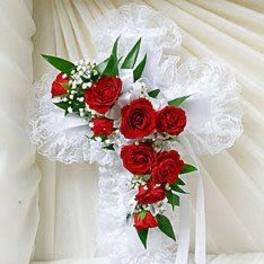 White lace bridal bouquet with red roses and ribbon