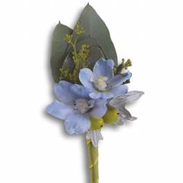 Small boutonniere with blue flowers and green leaves