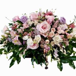 Pink and lavender floral casket spray with roses and alstroemeria