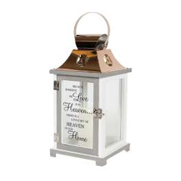 Decorative white lantern with a memorial quote on the front