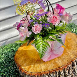 Pink and purple floral basket with butterfly decorations