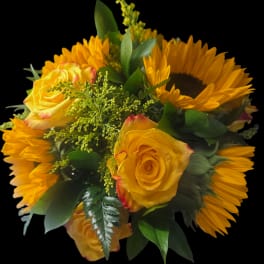 Yellow roses and sunflowers in a compact bouquet