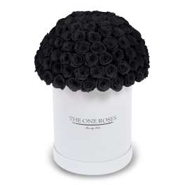 Black roses arranged in a white hat box