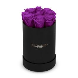Purple roses arranged in a black cylindrical box