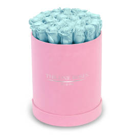 Blue roses in a pink round box