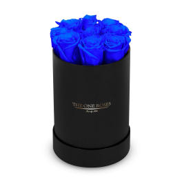 Blue roses arranged in a black round box