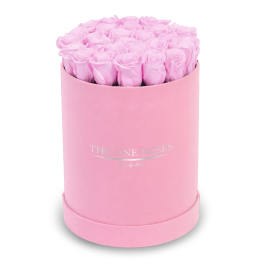Pink roses arranged in a round pink box