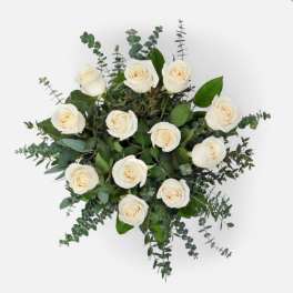 White rose bouquet with eucalyptus greenery on a white background