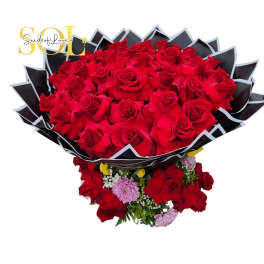Large bouquet of red roses with small pink flowers