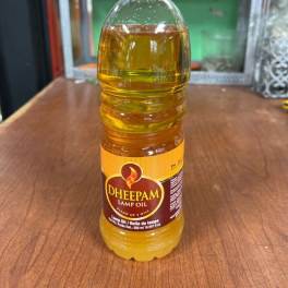 Bottle of lamp oil on a wooden table