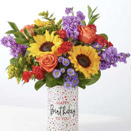 Colorful bouquet in a birthday gift container