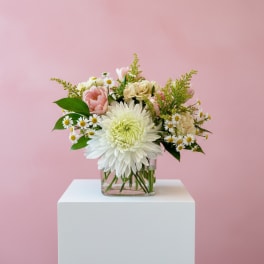 Pink and white mixed bouquet in a clear glass vase