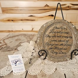 Decorative memorial plaque on a stand with a sympathy message