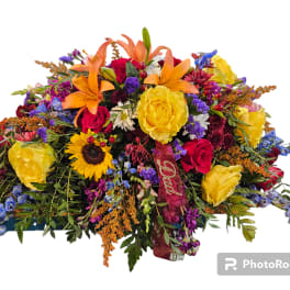Colorful mixed bouquet with roses, lilies, and sunflowers