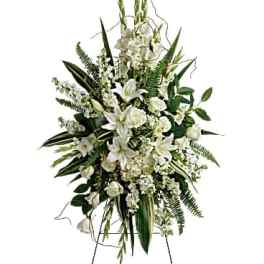 White floral standing spray on an easel