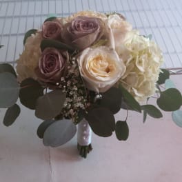 Bouquet of blush and cream roses with hydrangeas and eucalyptus