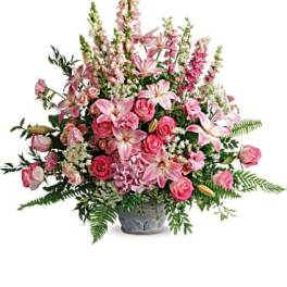 Pink and white floral arrangement in a gray vase