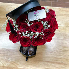 Red rose bouquet in a black gift box with chocolates