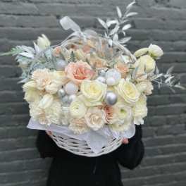 Cream and blush bouquet in a white basket with silver accents