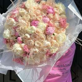 Large bouquet of blush and cream roses with pink accents