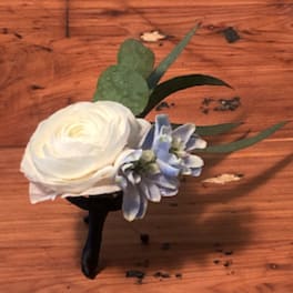 White boutonniere with a pale blue accent flower