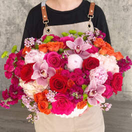 Large mixed bouquet with roses, orchids, and pink hydrangeas