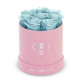 Blue roses in a pink round box with a heart logo