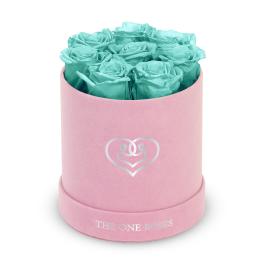 Turquoise roses in a pink round box with a heart logo