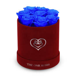 Blue roses arranged in a red round box with a heart logo