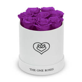 Purple roses in a white round box with a heart logo
