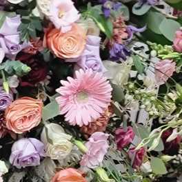 Mixed bouquet with pink, peach, and lavender flowers
