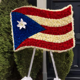 Floral tribute arranged as the Puerto Rico flag on an easel