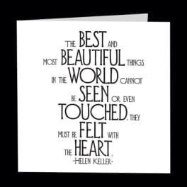 White card with a black Helen Keller quote in decorative text