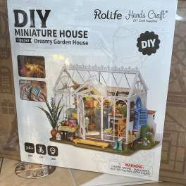 Box for a DIY miniature greenhouse house kit with a garden scene