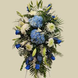 Blue and white floral standing spray with lilies and hydrangeas