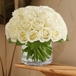 Bouquet of white roses in a clear glass vase