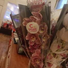 Pink orchid bouquet with a Happy Valentine's Day balloon