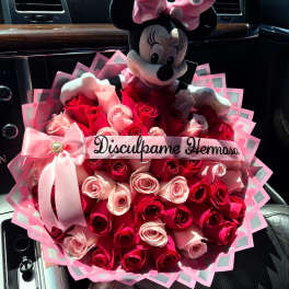 Bouquet of pink and red roses with a Minnie Mouse plush topper