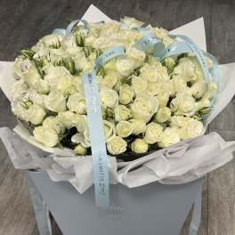 Large bouquet of white roses in a pale blue gift box