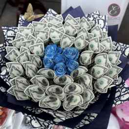 Bouquet of blue roses surrounded by folded dollar bills