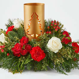 Holiday centerpiece with red and white roses around a gold candle holder
