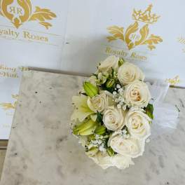 Cream rose bouquet with white lilies and small filler flowers