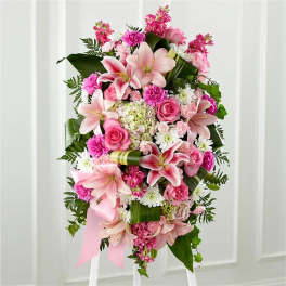 Pink and white floral standing spray with lilies and roses