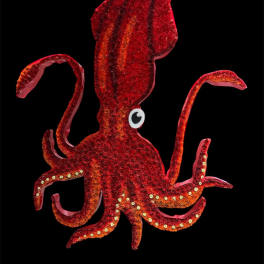 Red glitter squid-shaped decoration on a black background