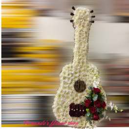 Tall guitar-shaped floral tribute in white with red roses and gold string accents