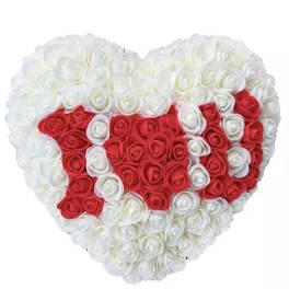 Heart-shaped arrangement of red and white roses