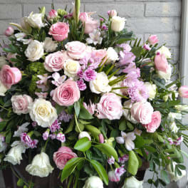 Large bouquet of pink and white roses with mixed blooms