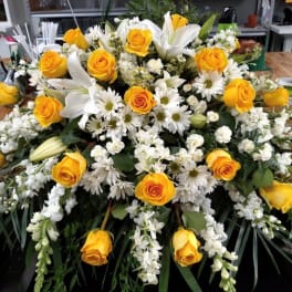 Large bouquet of yellow roses, white lilies, and white daisies