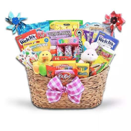 Gift basket filled with candy, toys, and a pink bow